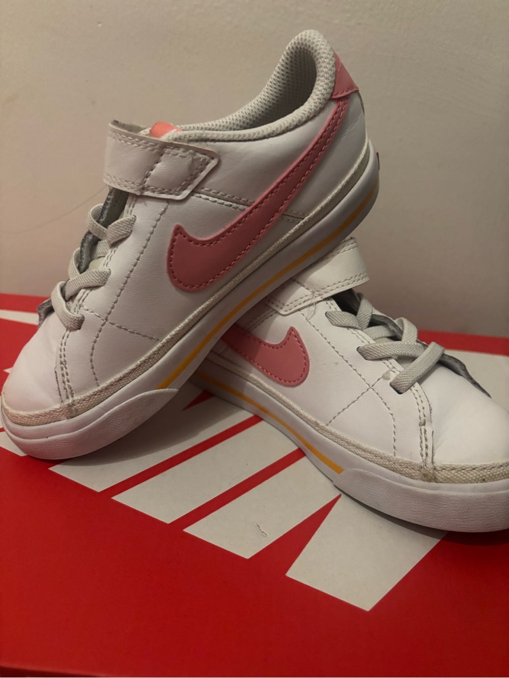 Nike Kids White Sneakers with Pink Swoosh and Yellow Accent